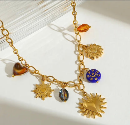 Set sol corazón baño oro 18k.