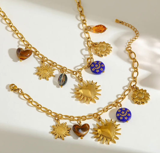 Set sol corazón baño oro 18k.