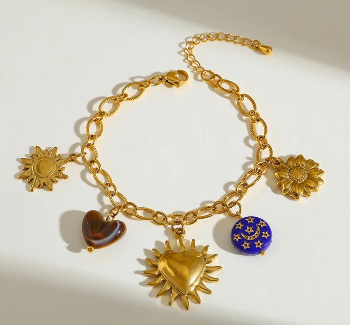 Set sol corazón baño oro 18k.