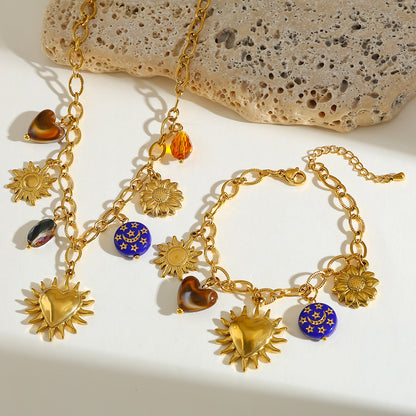 Set sol corazón baño oro 18k.